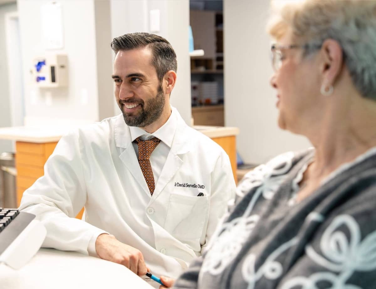 doctor Servello smiling with patient
